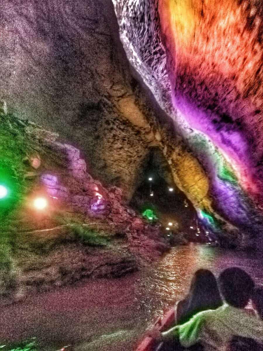 riding the boat on the river inside limestone formations inside Huanglong (Yellow Dragon) Cave - Zhangjiajie, Hunan, China