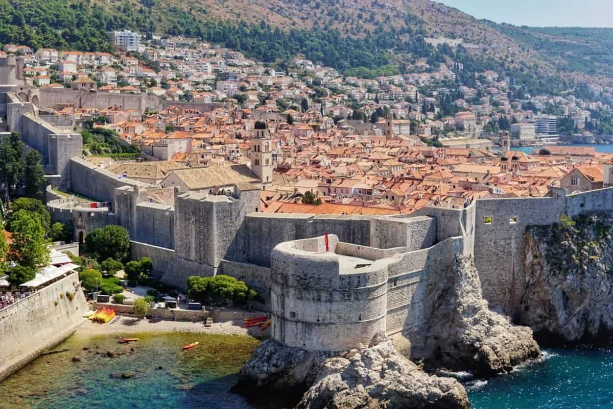 Family Time in Dubrovnik, Croatia Aerial view of the old town of Dubrovnik, Croatia, showcasing its medieval stone walls, historical buildings with terracotta rooftops, and the surrounding coastline.
