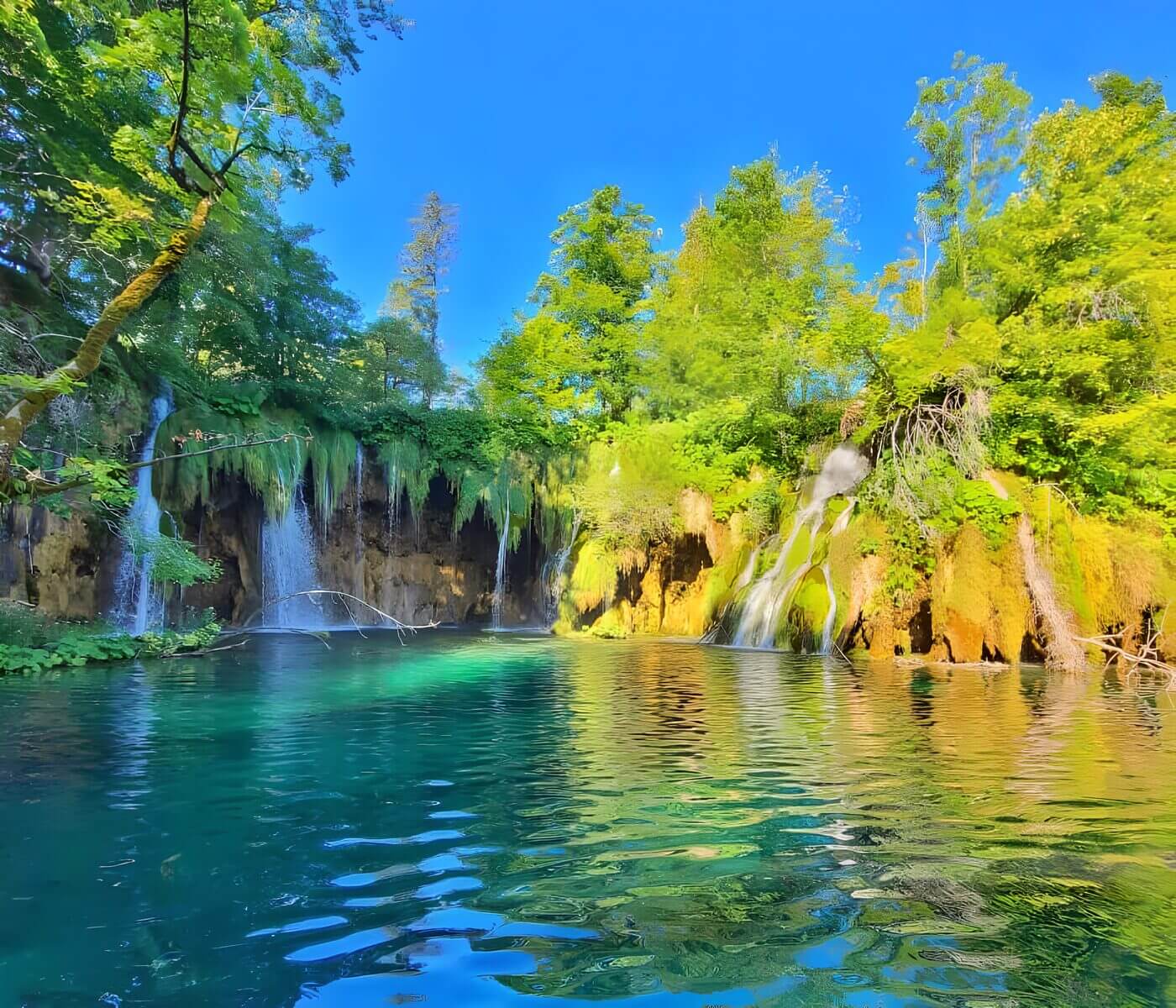 mutiple waterfalls at Plitvice Scenic view of waterfalls and lush greenery at Plitvice Lakes National Park, Croatia.