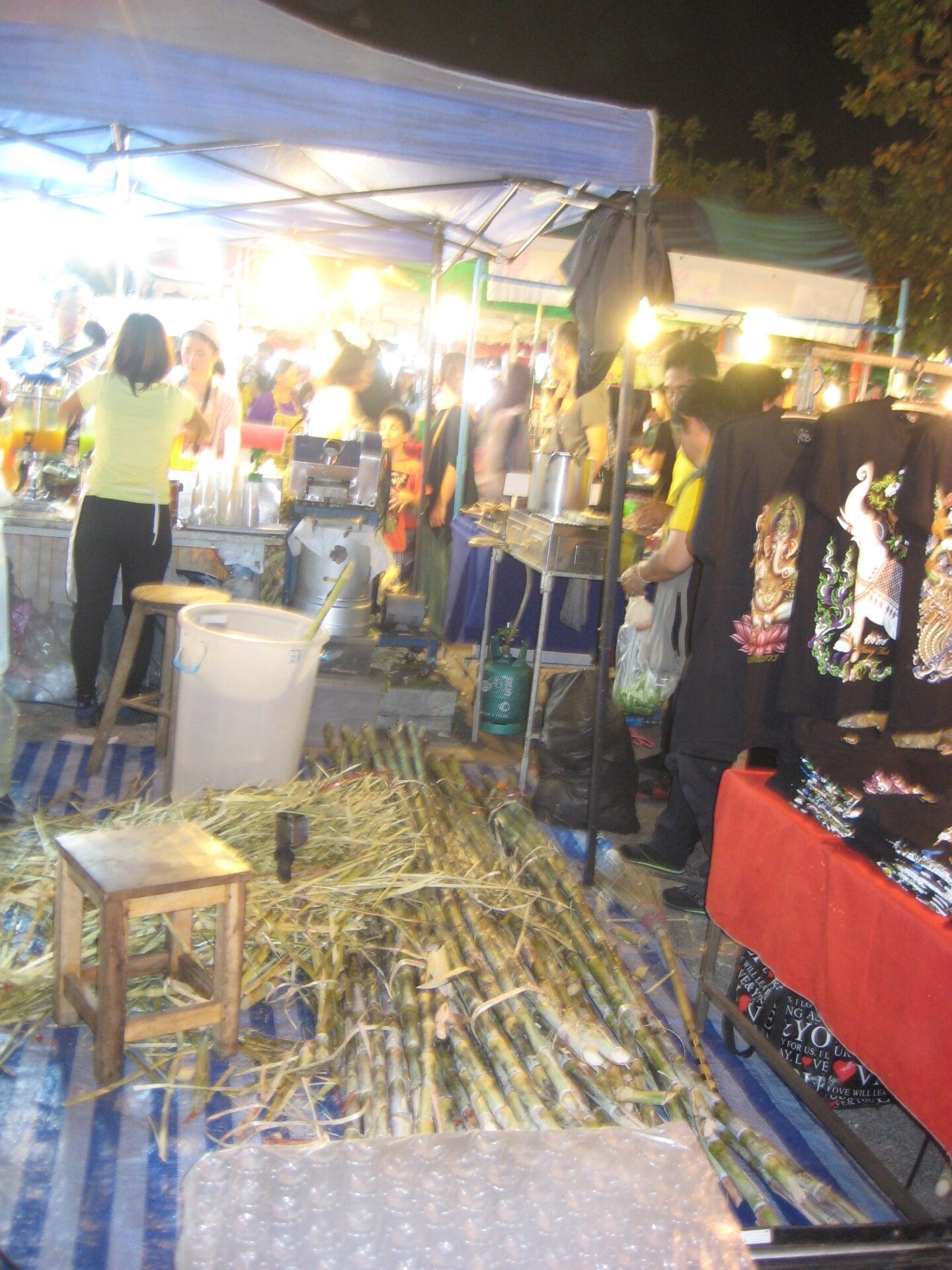 Sunday Market Chiang Mai, Thailand: sugar cane being juiced