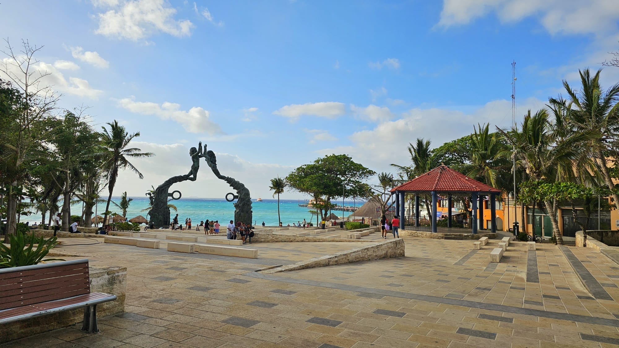 View of the seaside and the Portal Maya statue at Founders Park in Playa del Carmen, Mexico.